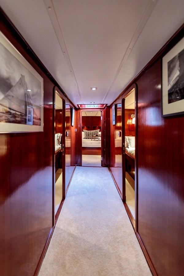 a hallway with a door and a window aboard VITA DOLCE Yacht for Sale
