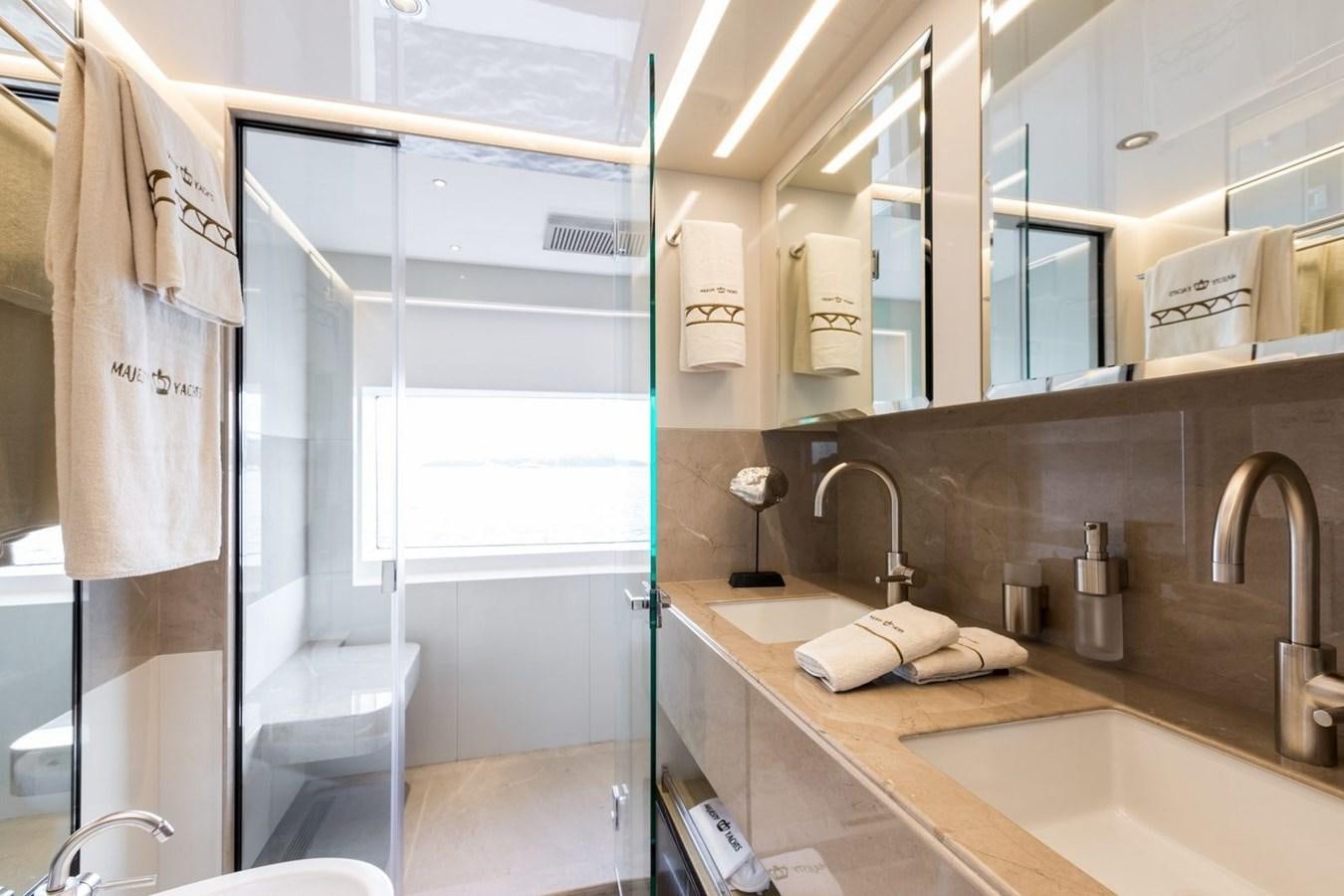 a bathroom with a glass shower aboard BARBARA Yacht for Sale