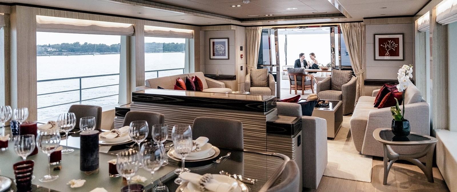 a large dining room with a large window aboard BARBARA Yacht for Sale