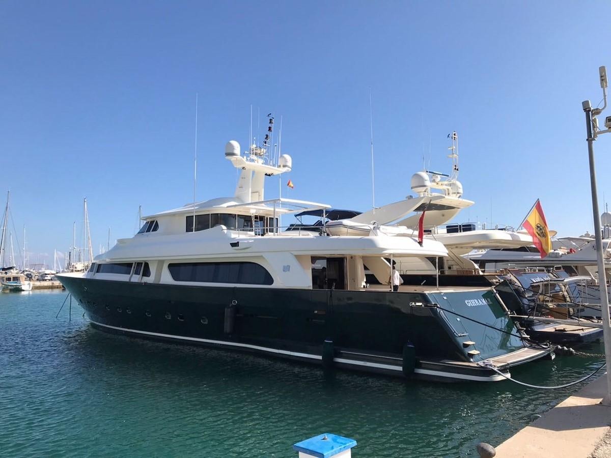 a boat docked at a pier aboard GIHRAMAR Yacht for Sale