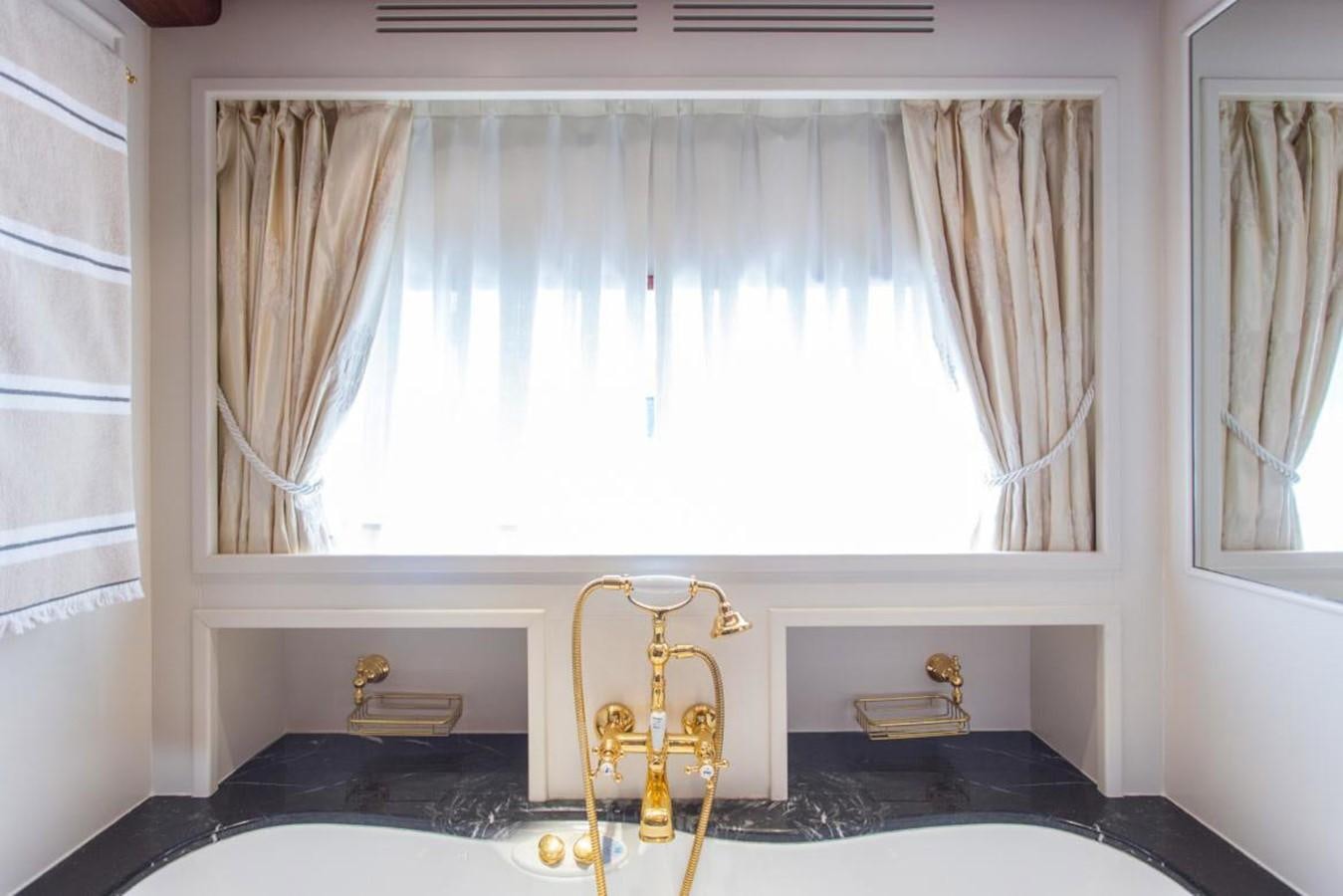 a gold object on a table aboard GIHRAMAR Yacht for Sale