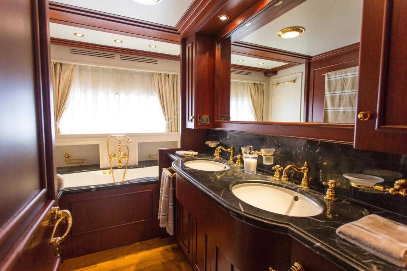 a bathroom with a large mirror aboard GIHRAMAR Yacht for Sale