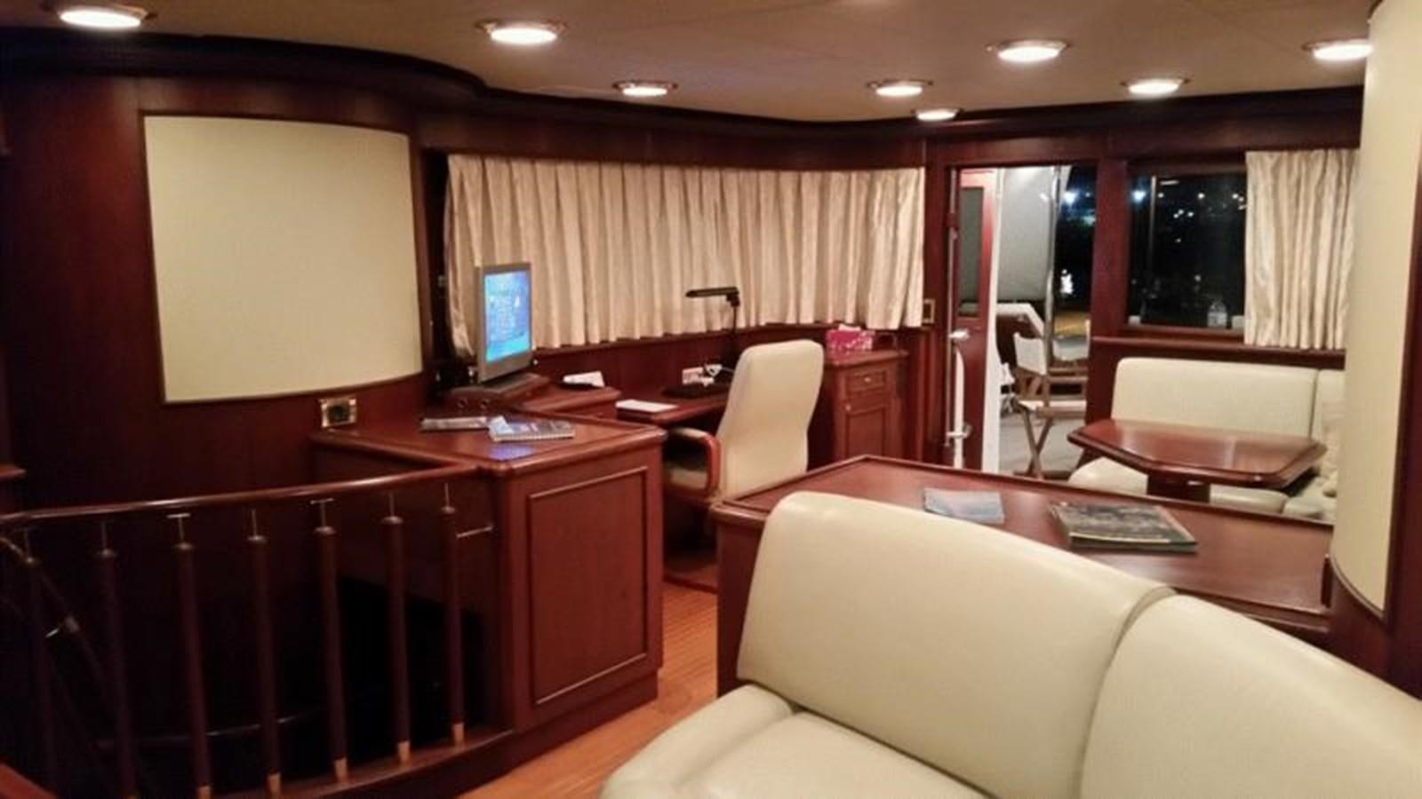 a room with a desk and a computer aboard GIHRAMAR Yacht for Sale