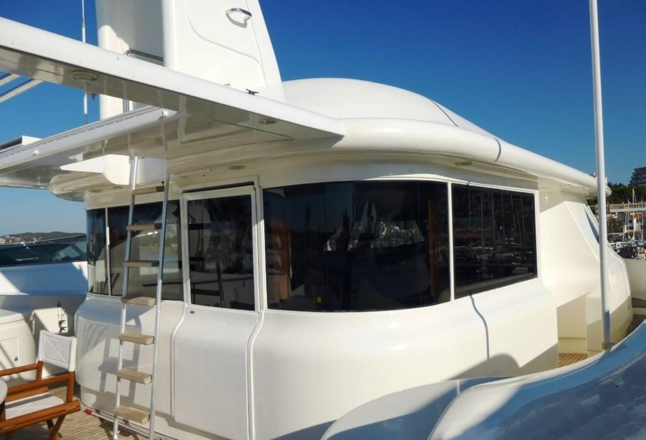 a white boat with windows aboard GIHRAMAR Yacht for Sale