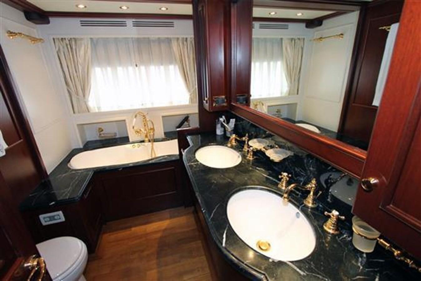 a bathroom with a sink and a bathtub aboard GIHRAMAR Yacht for Sale