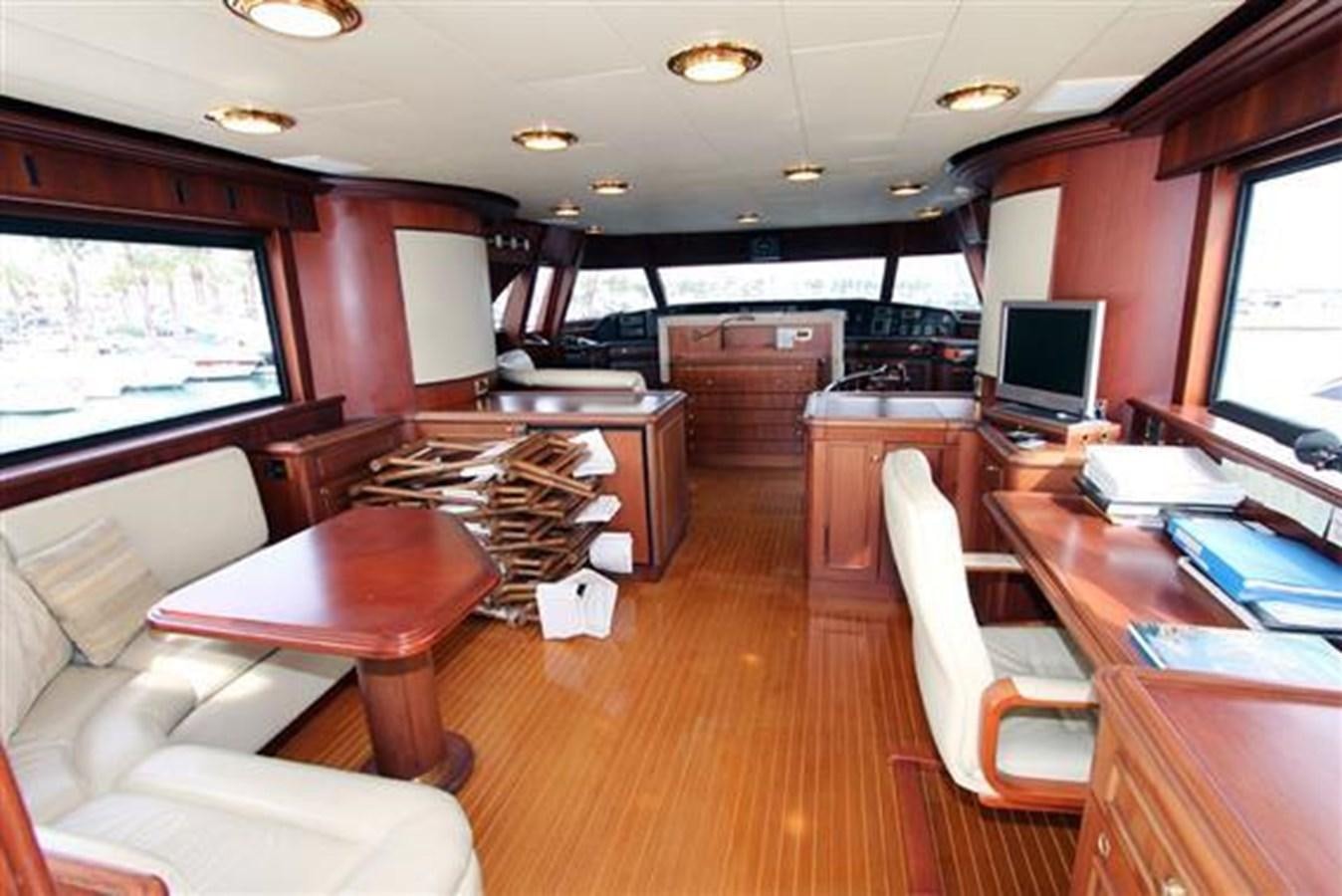 a living room with a wood floor aboard GIHRAMAR Yacht for Sale