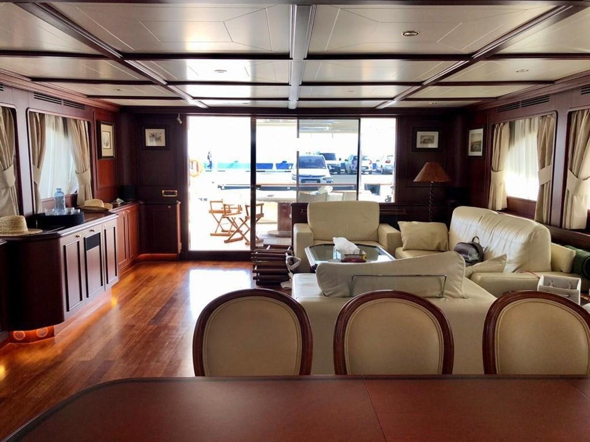 a living room with a large window aboard GIHRAMAR Yacht for Sale