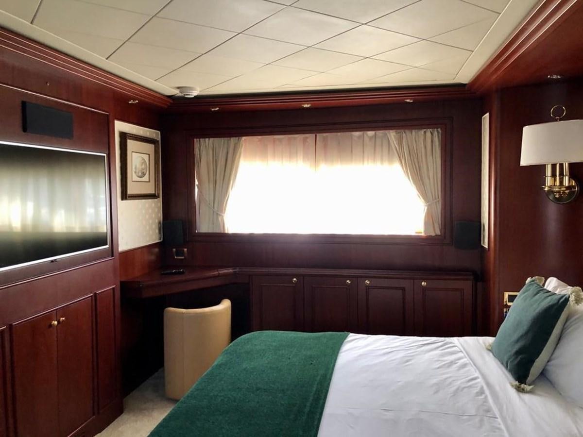 a room with a bed and a television aboard GIHRAMAR Yacht for Sale