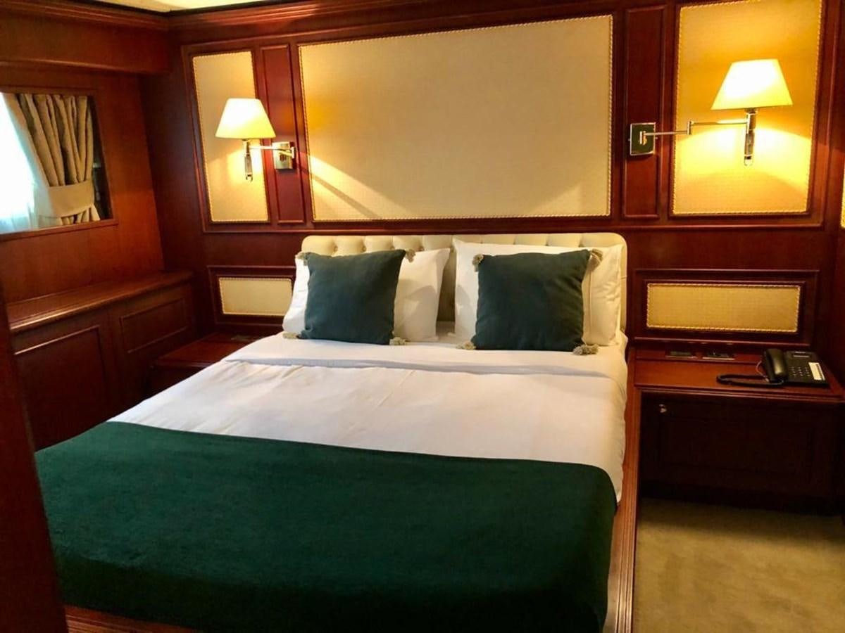 a bed with pillows aboard GIHRAMAR Yacht for Sale