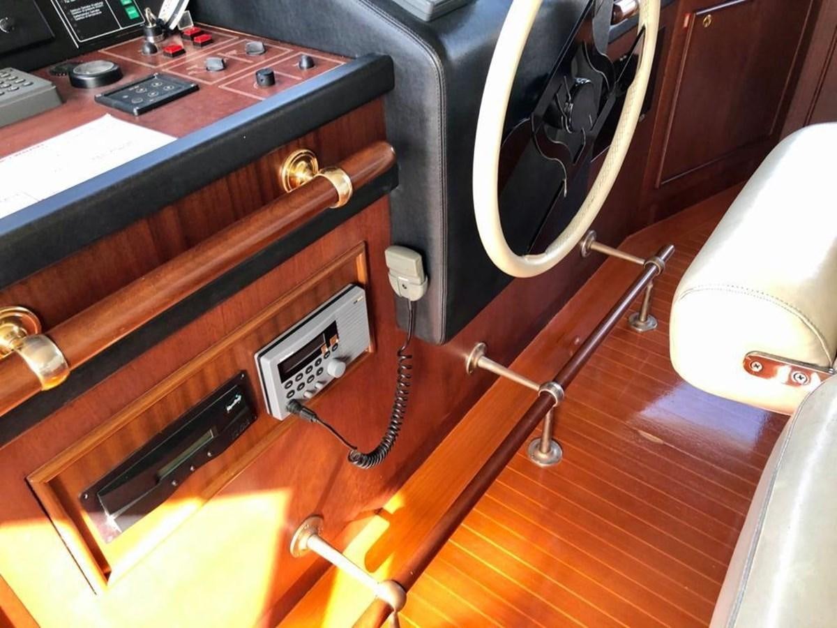 a wooden desk with a microphone aboard GIHRAMAR Yacht for Sale