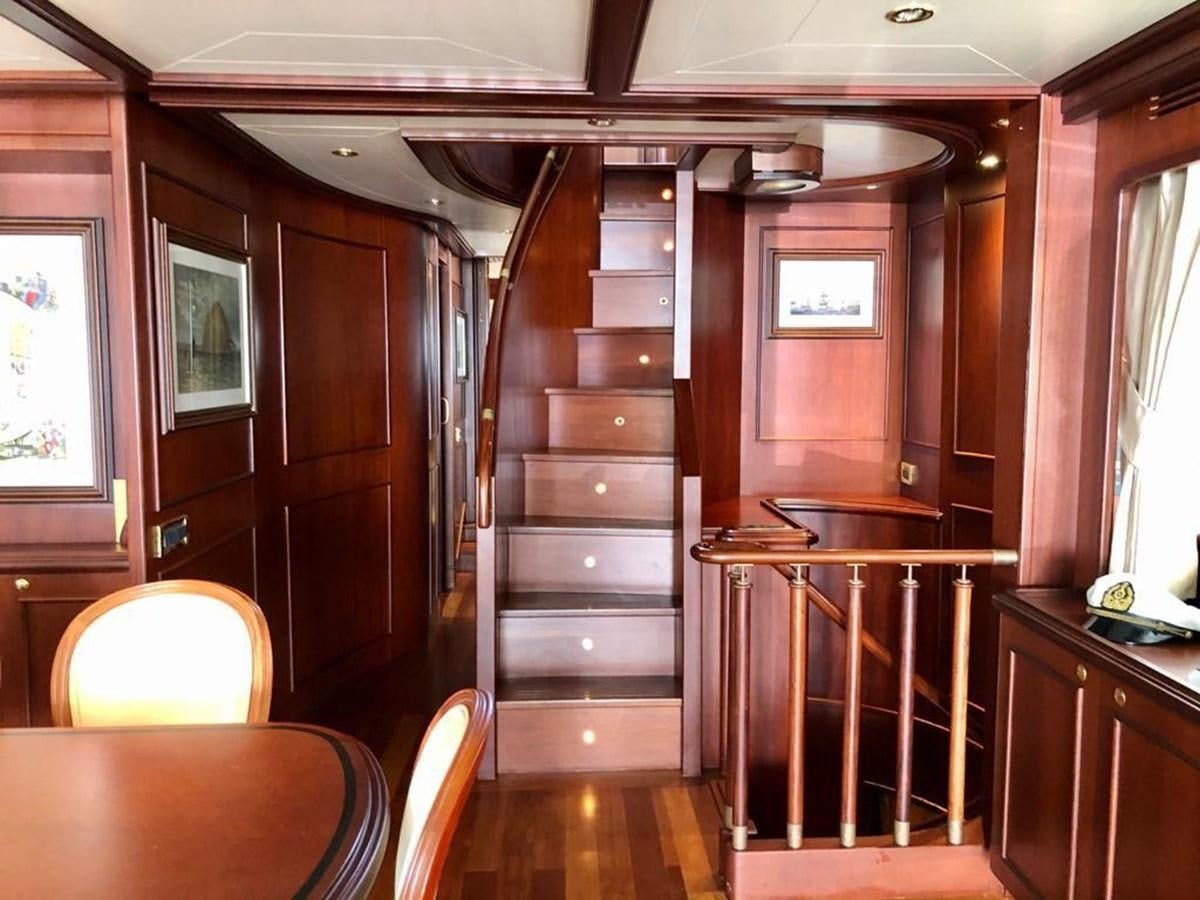 a wooden cabinet in a room aboard GIHRAMAR Yacht for Sale