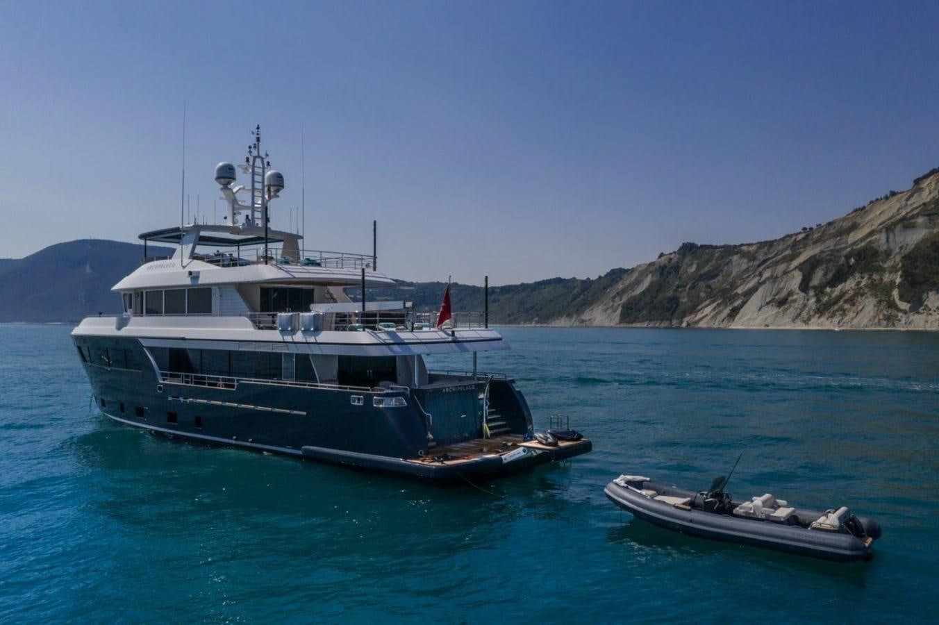 a boat and a boat in the water aboard DARWIN CLASS 102 Yacht for Sale