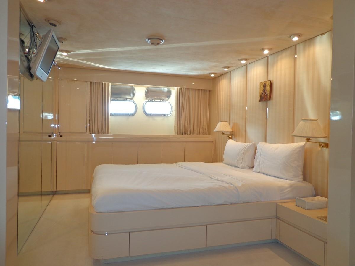 a room with a bed and a television aboard AKHIR 31 Yacht for Sale