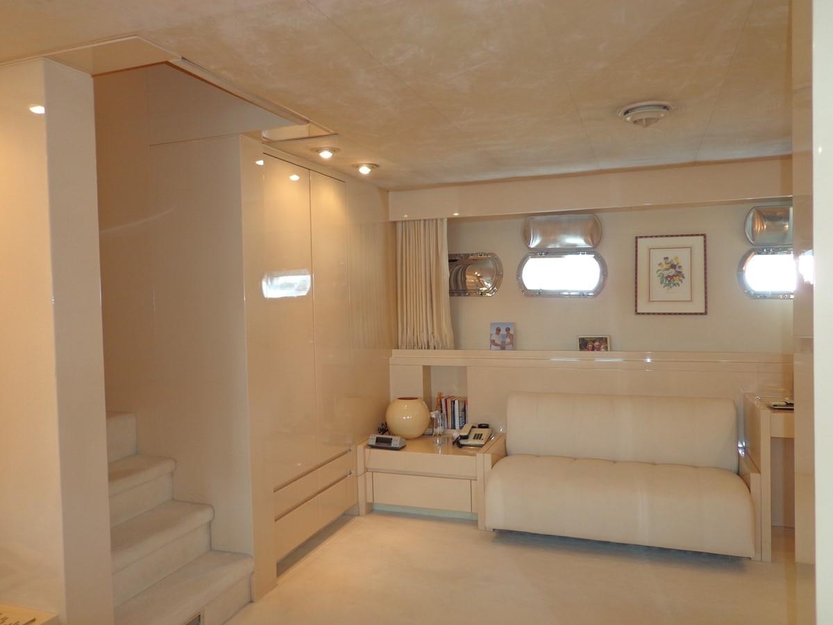 a living room with a couch and a table aboard AKHIR 31 Yacht for Sale