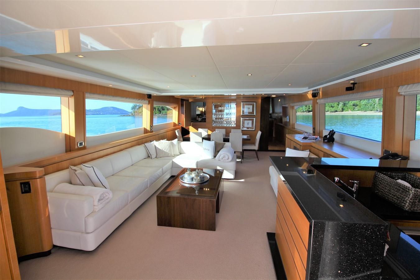 a living room with a large window aboard EUPHORIA Yacht for Sale