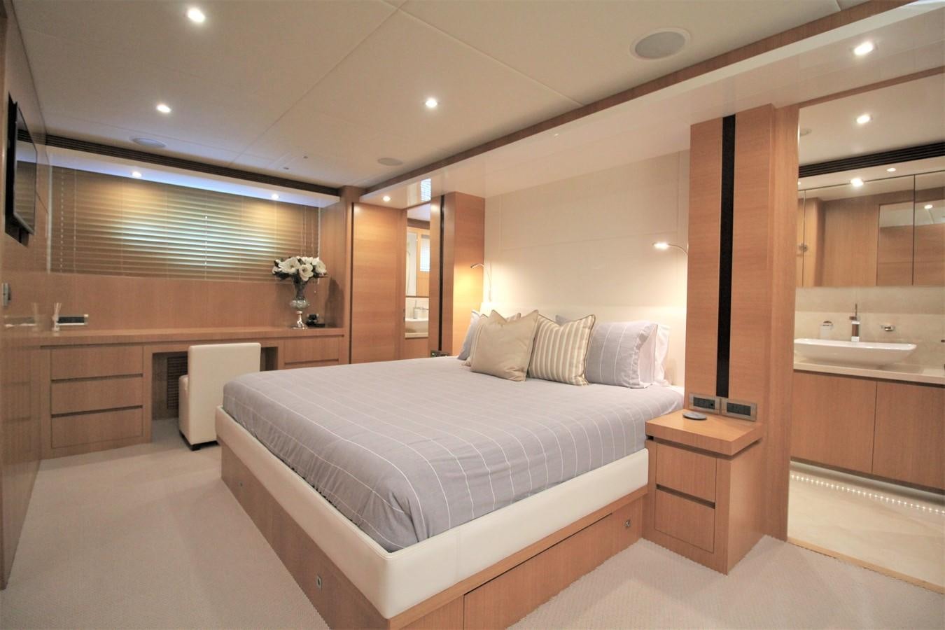 a large bedroom with a large bed aboard EUPHORIA Yacht for Sale