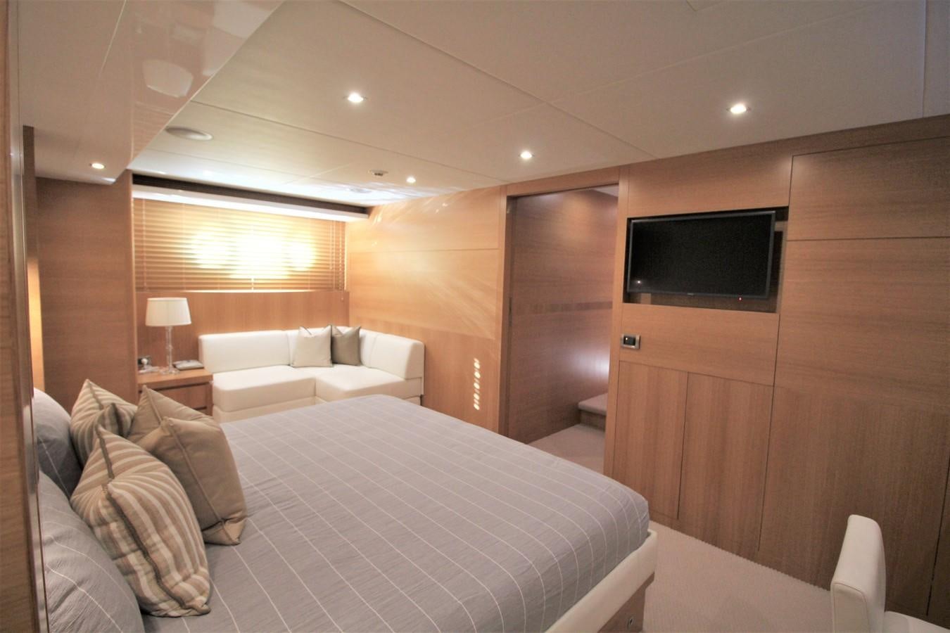 a room with a bed and a tv aboard EUPHORIA Yacht for Sale