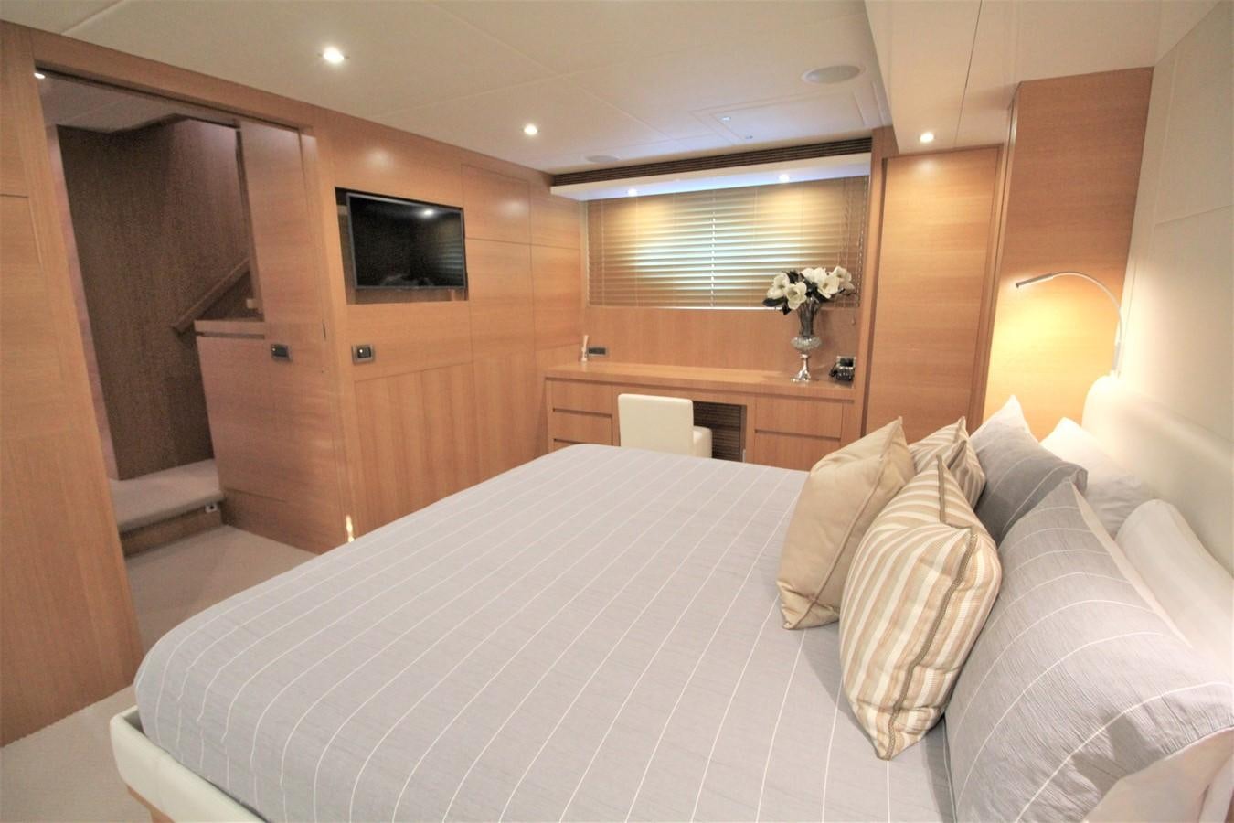 a bed with white sheets aboard EUPHORIA Yacht for Sale