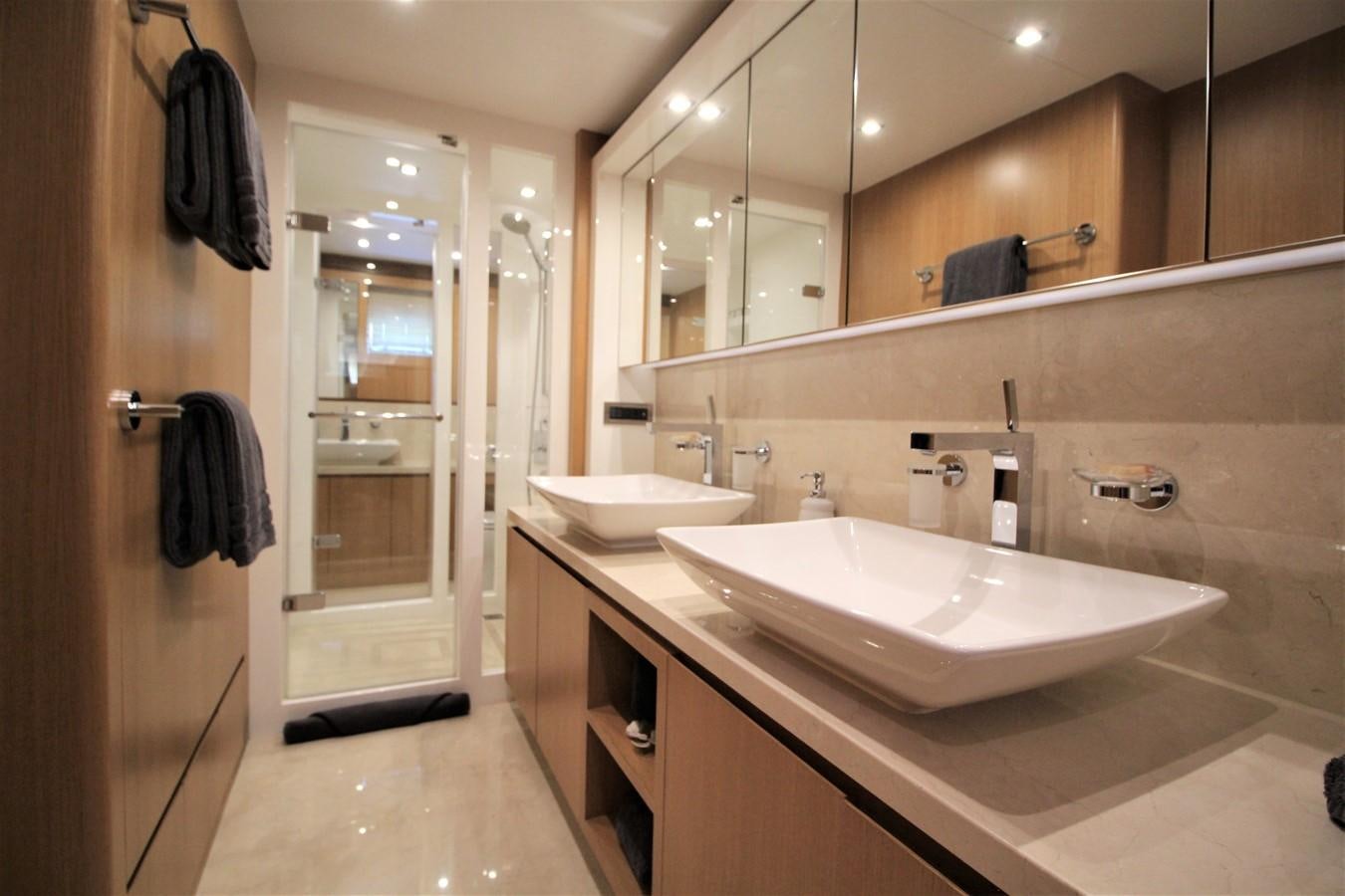 a bathroom with sinks and mirrors aboard EUPHORIA Yacht for Sale
