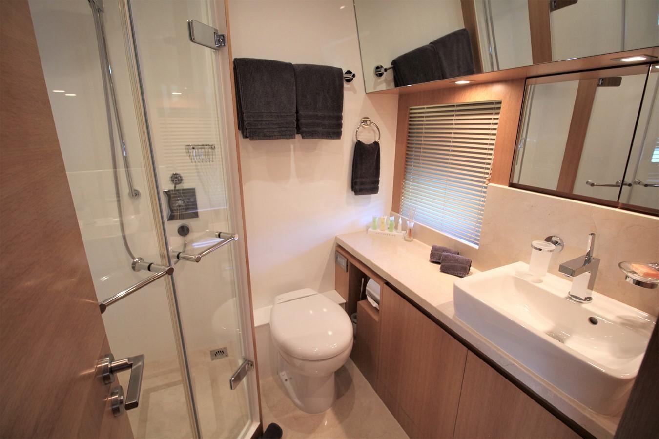 a bathroom with a glass shower aboard EUPHORIA Yacht for Sale