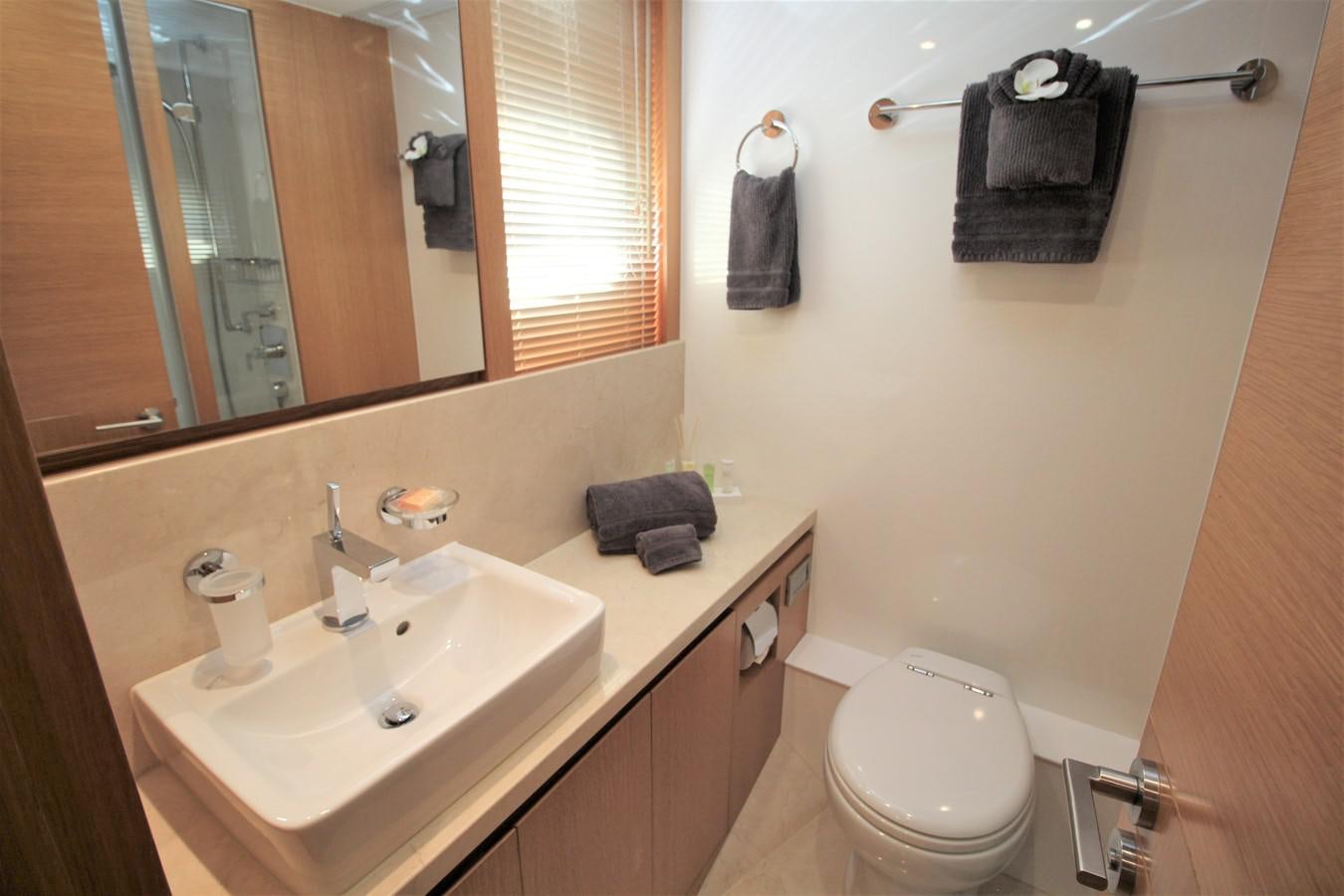 a bathroom with a sink and a toilet aboard EUPHORIA Yacht for Sale