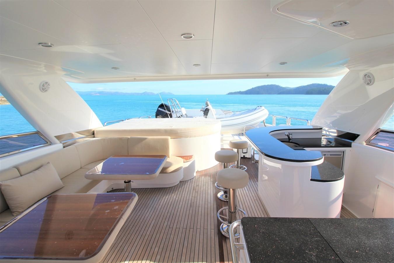 a boat with a table and chairs aboard EUPHORIA Yacht for Sale