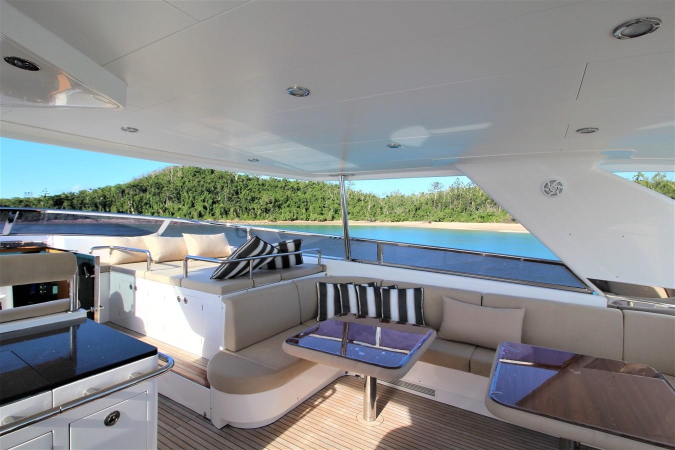 a boat with a deck and a pool aboard EUPHORIA Yacht for Sale