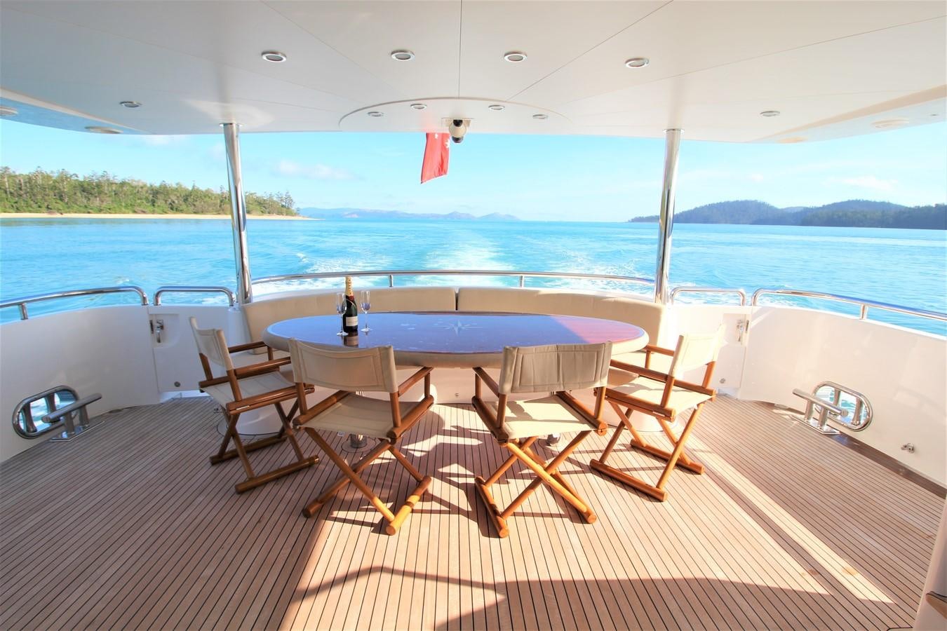 a deck with chairs and tables on it aboard EUPHORIA Yacht for Sale