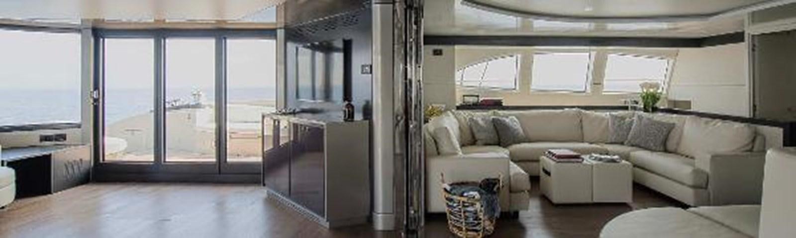 a living room with a couch and a table aboard JAMADHAR Yacht for Sale