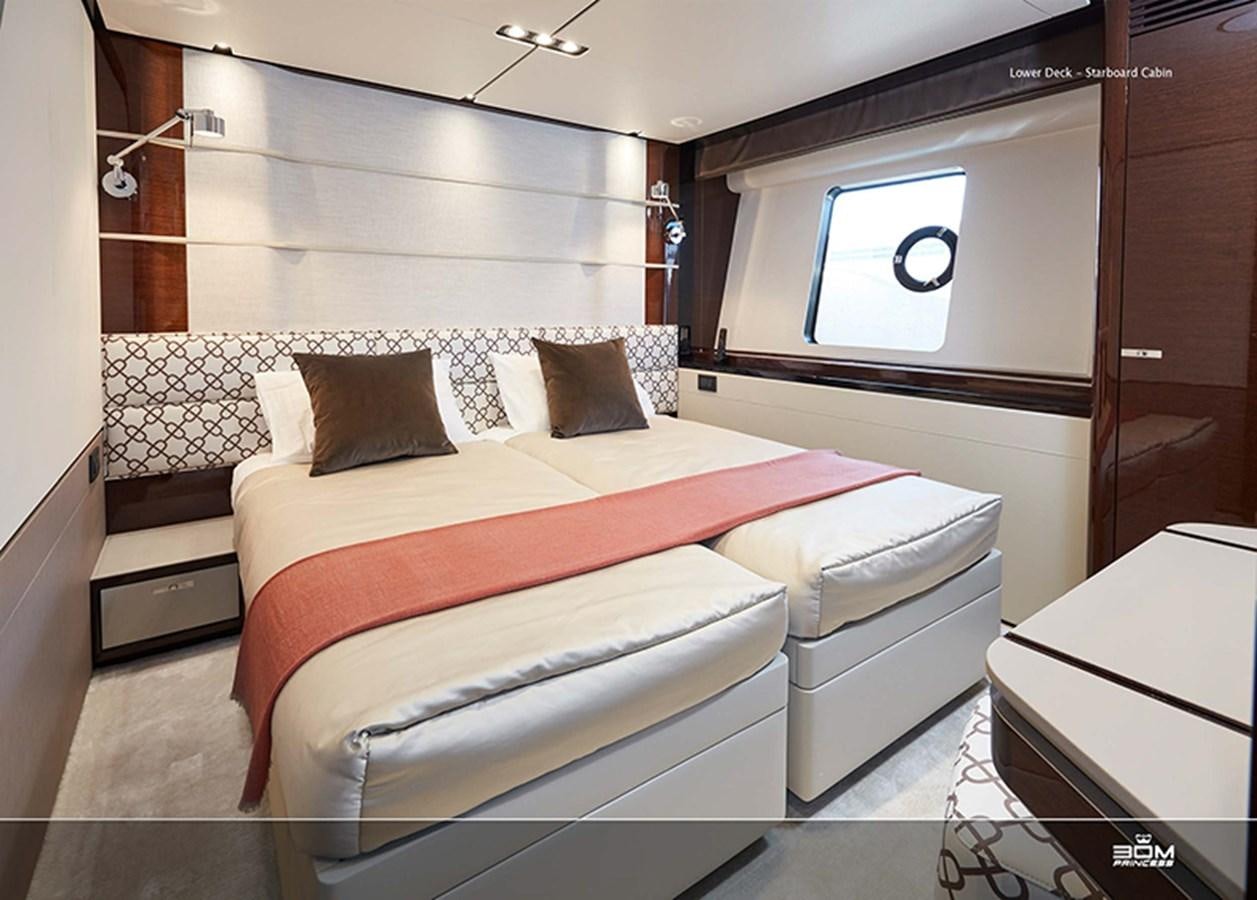 a room with a bed and a window aboard PRINCESS 30M Yacht for Sale