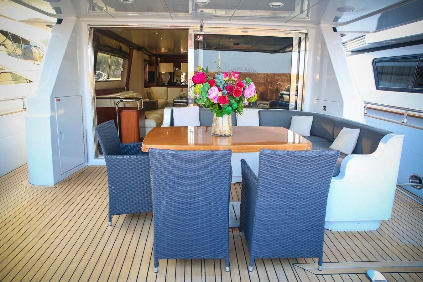 a room with tables and chairs aboard QUEEN SOUTH Yacht for Sale