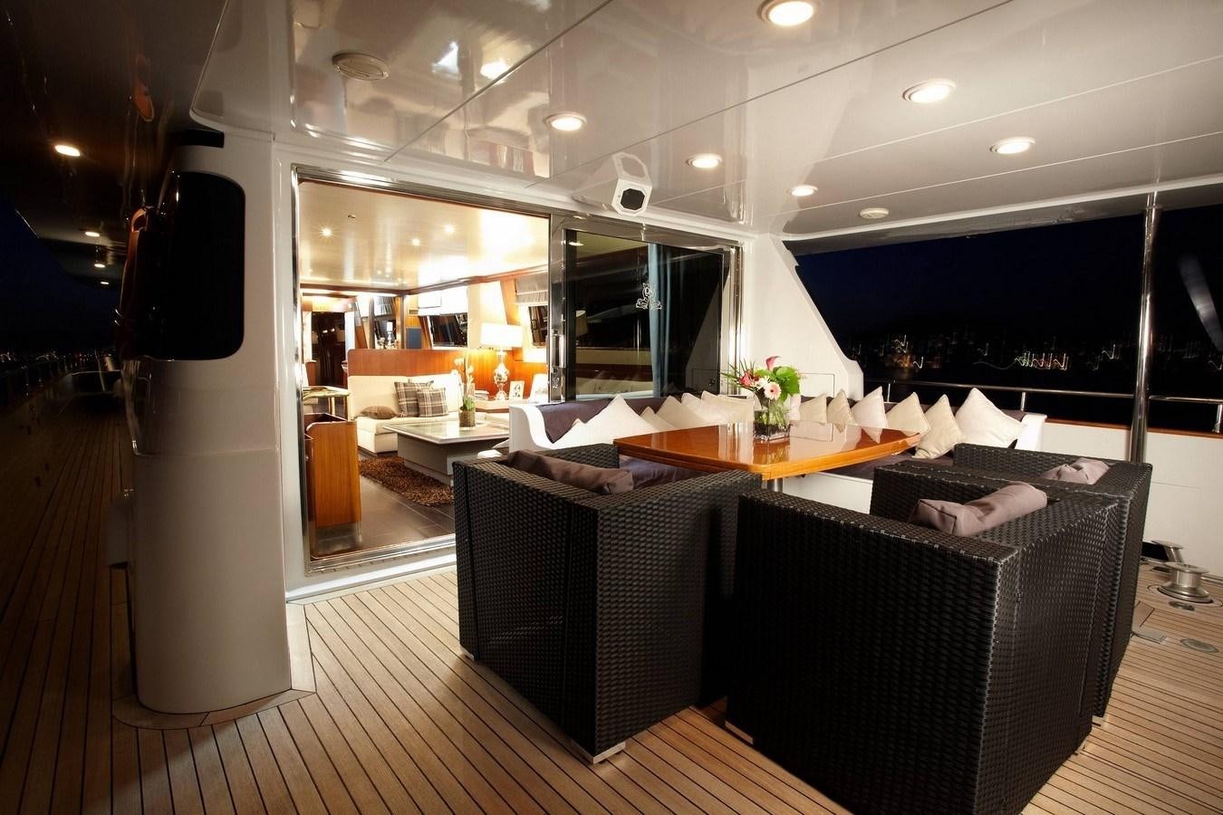 a room with a table and chairs aboard QUEEN SOUTH Yacht for Sale