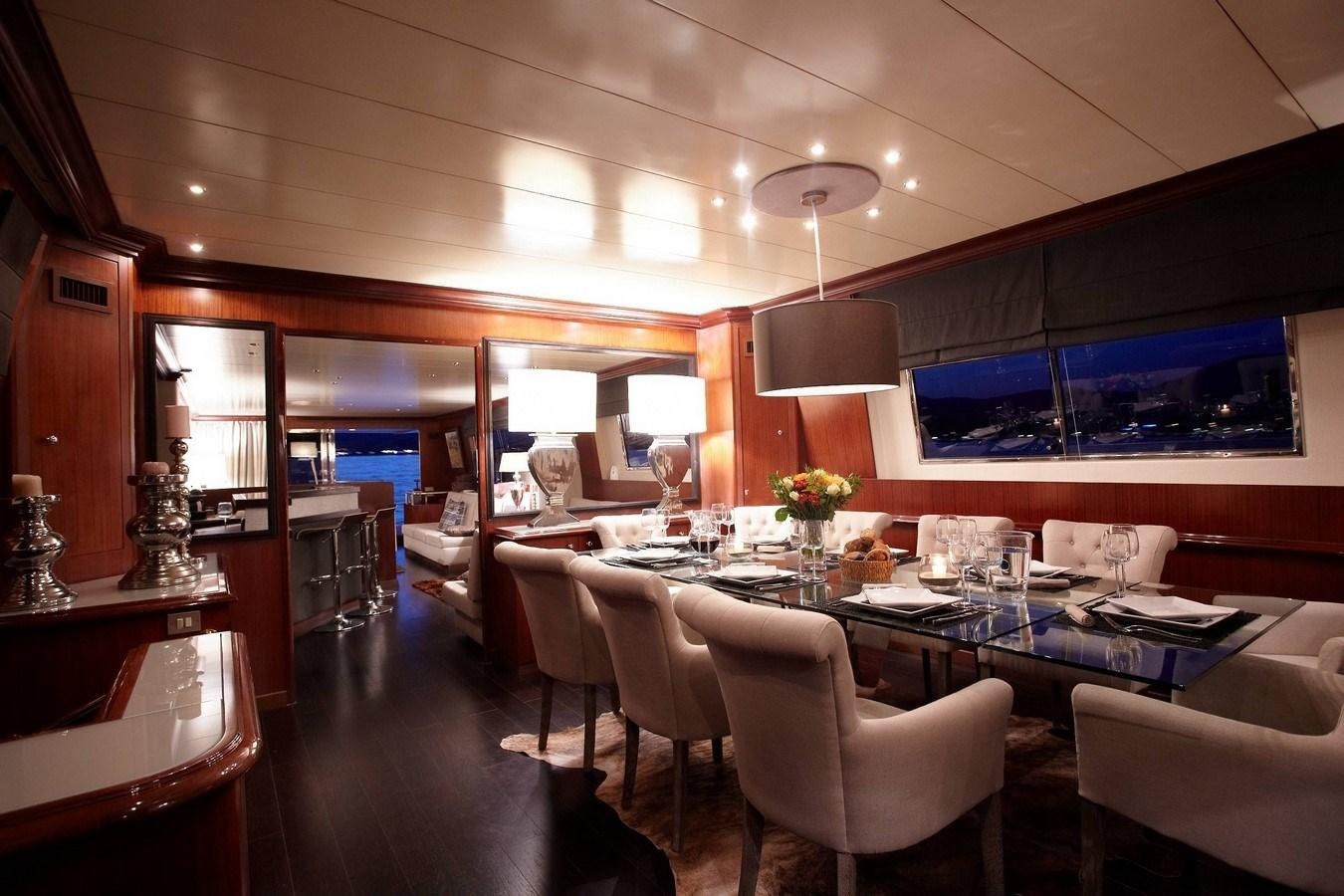 a restaurant with tables and chairs aboard QUEEN SOUTH Yacht for Sale