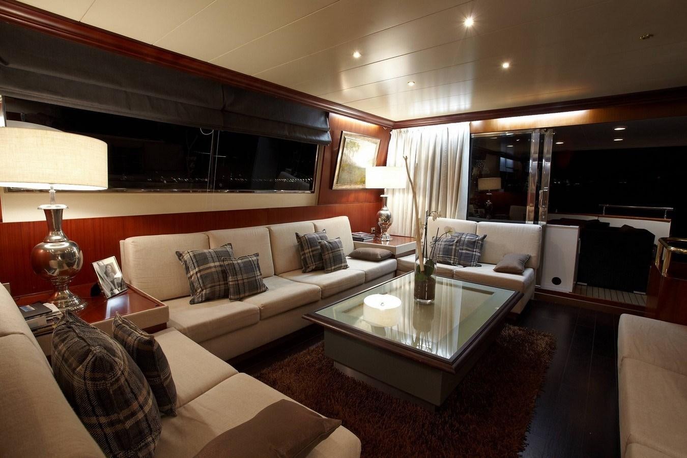 a living room with a large window aboard QUEEN SOUTH Yacht for Sale