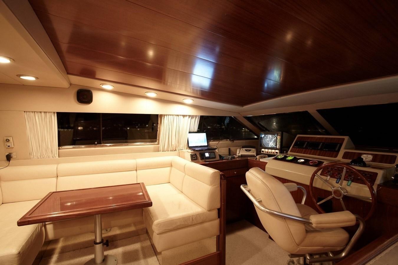 a room with a couch and a table and chairs aboard QUEEN SOUTH Yacht for Sale