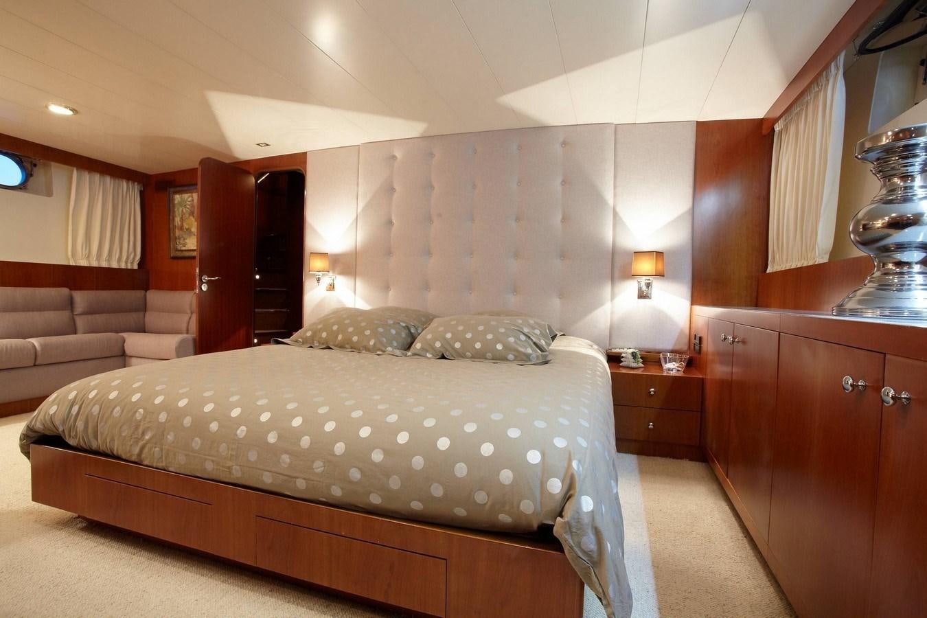 a bed in a room aboard QUEEN SOUTH Yacht for Sale