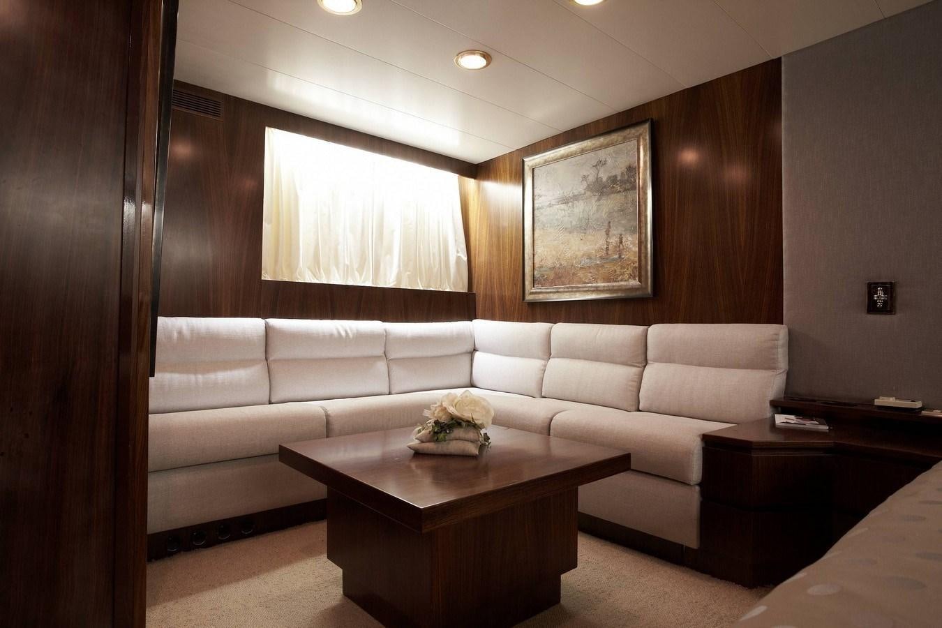 a living room with a white couch aboard QUEEN SOUTH Yacht for Sale