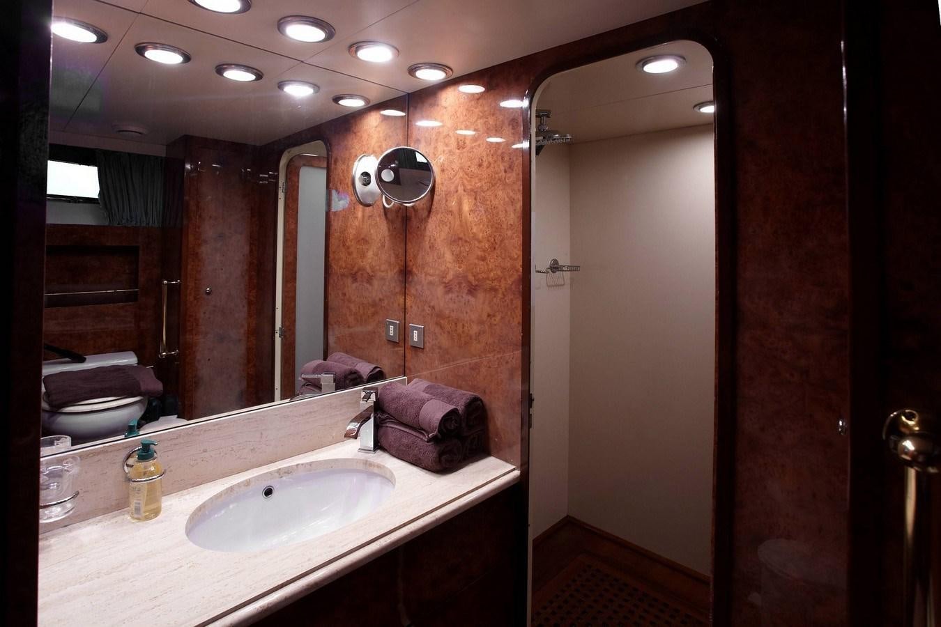 a bathroom with a large mirror aboard QUEEN SOUTH Yacht for Sale