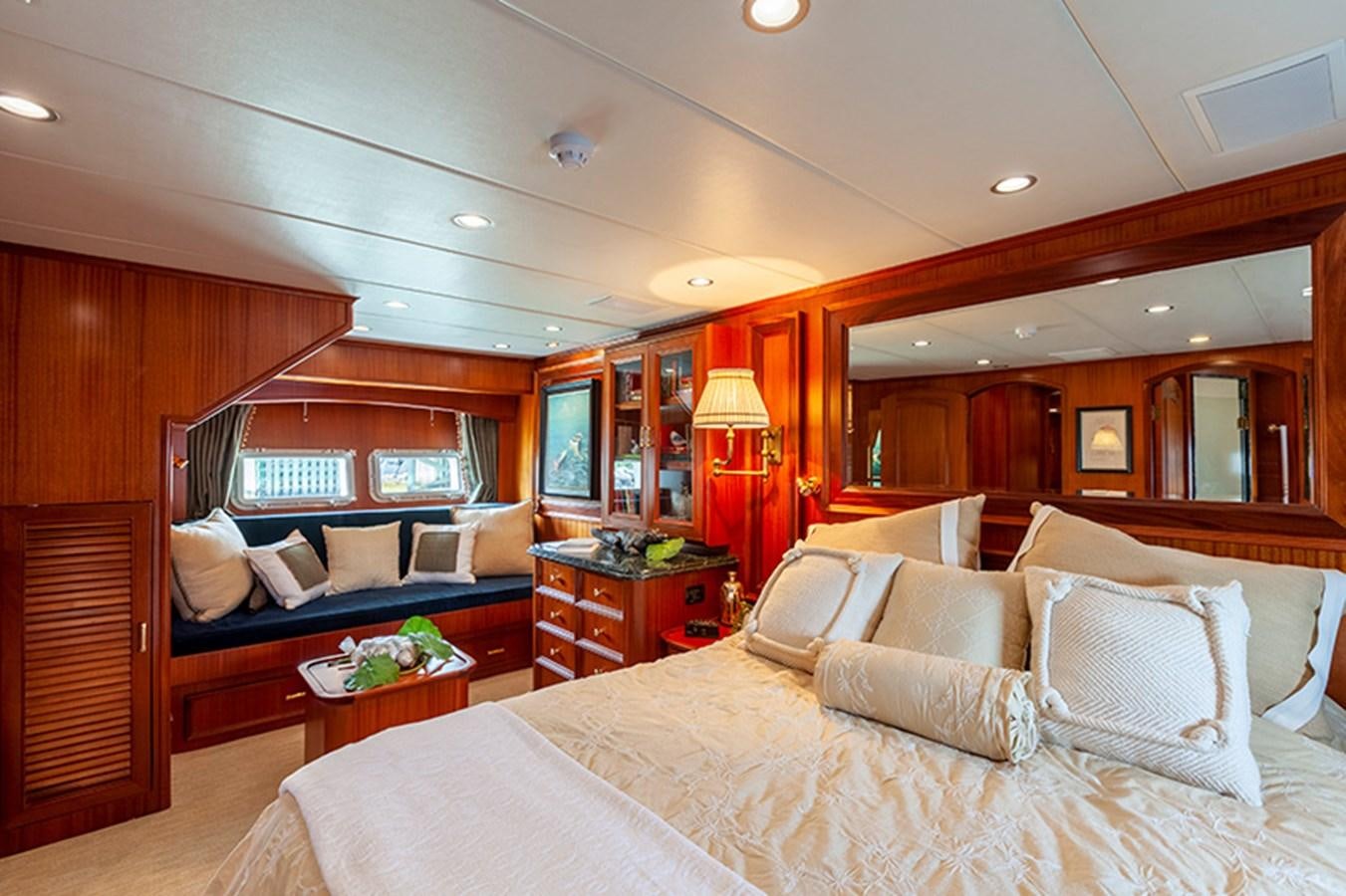 a room with a bed and a desk aboard RHAPSODY Yacht for Sale