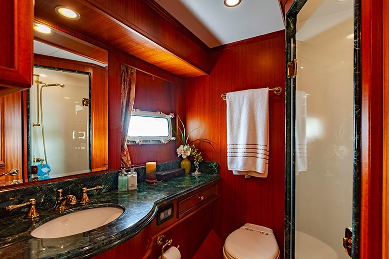 a bathroom with a large mirror aboard RHAPSODY Yacht for Sale