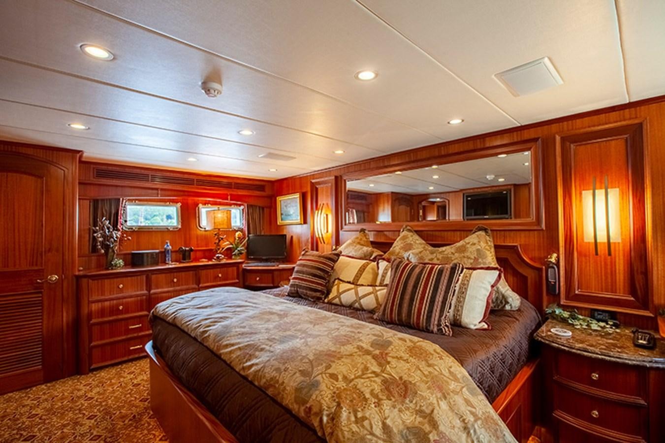 a bedroom with a large bed aboard RHAPSODY Yacht for Sale