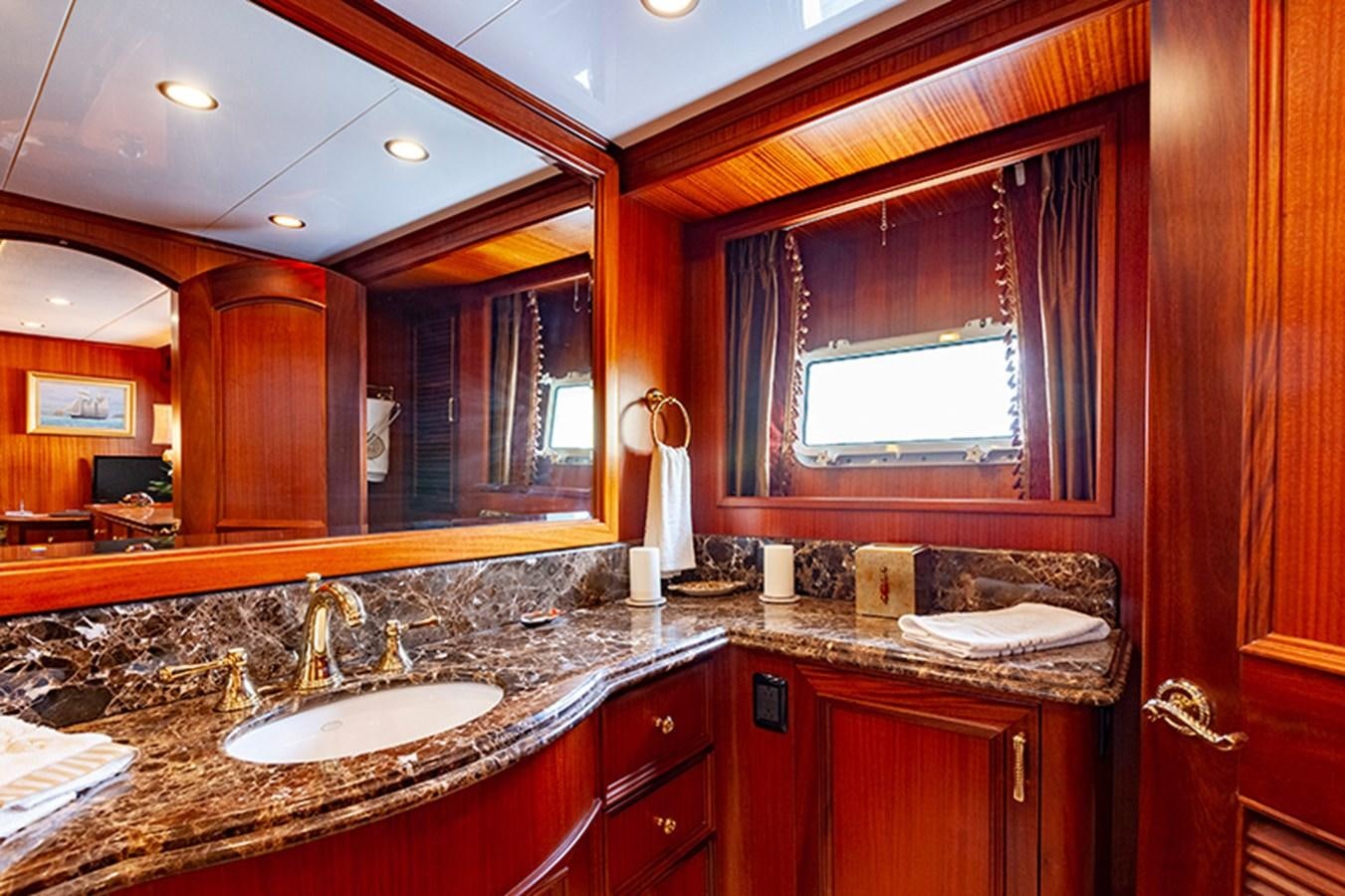 a bathroom with a large mirror aboard RHAPSODY Yacht for Sale