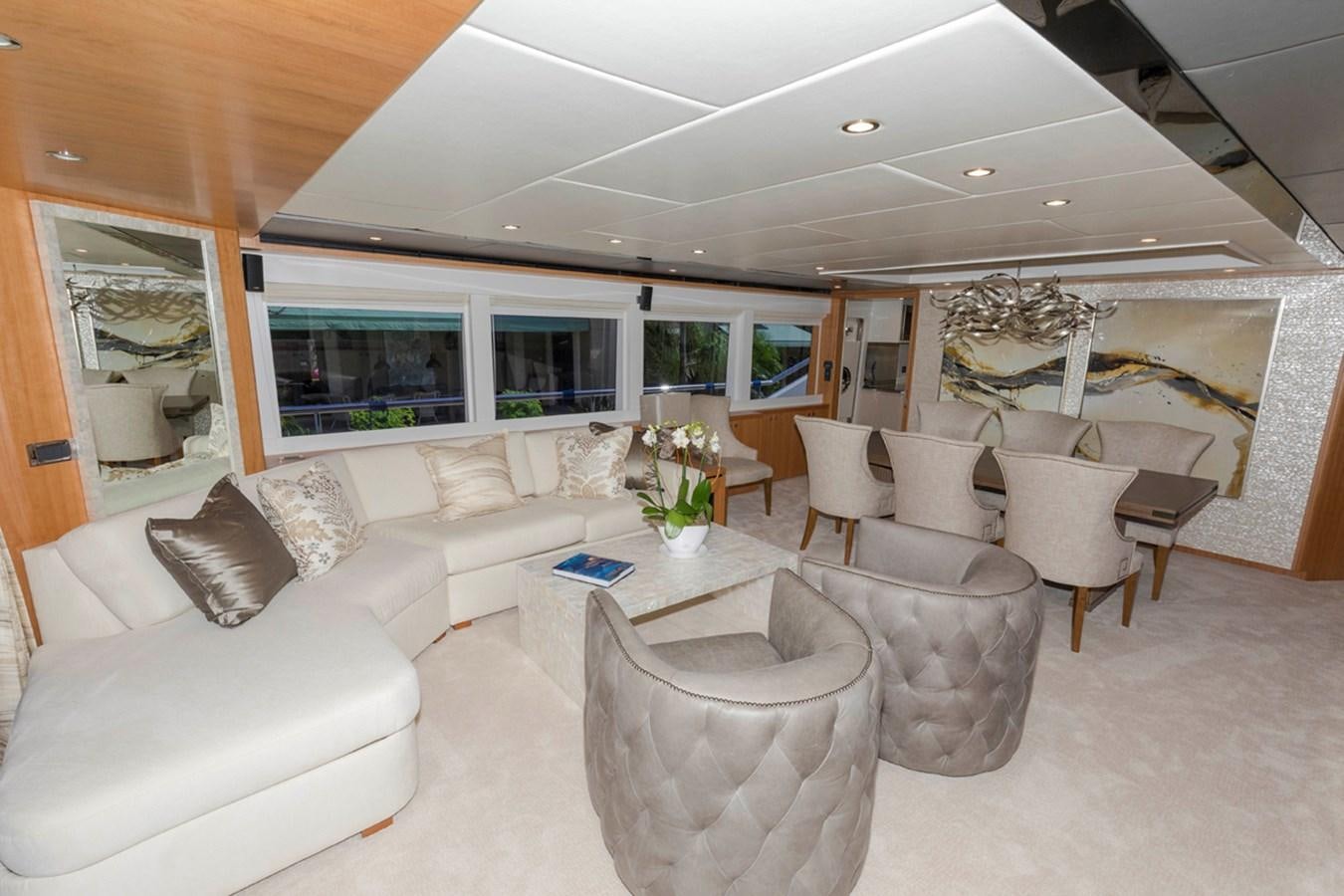 a living room with a large window aboard DUMB ASS Yacht for Sale