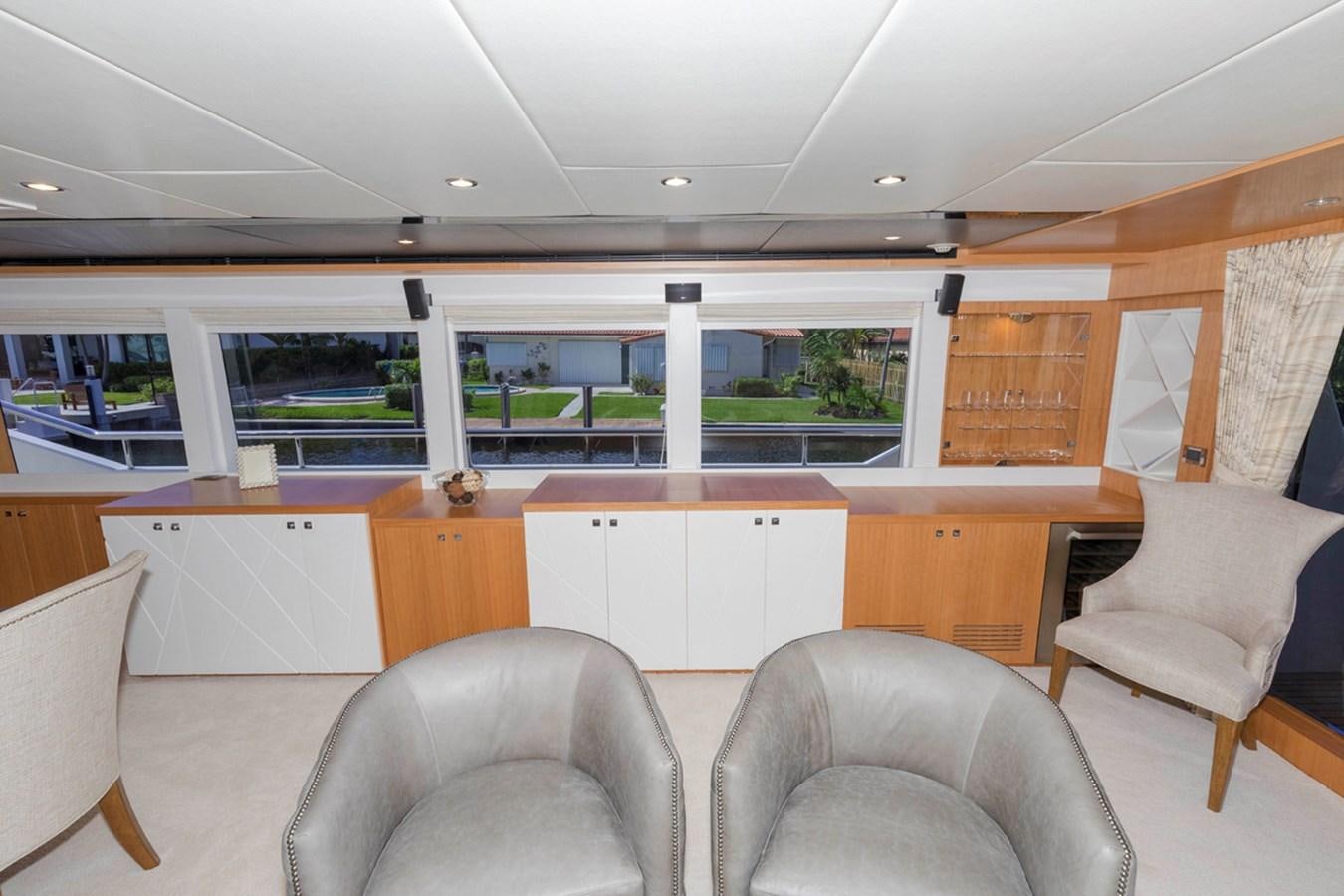 a room with chairs and a desk aboard DUMB ASS Yacht for Sale