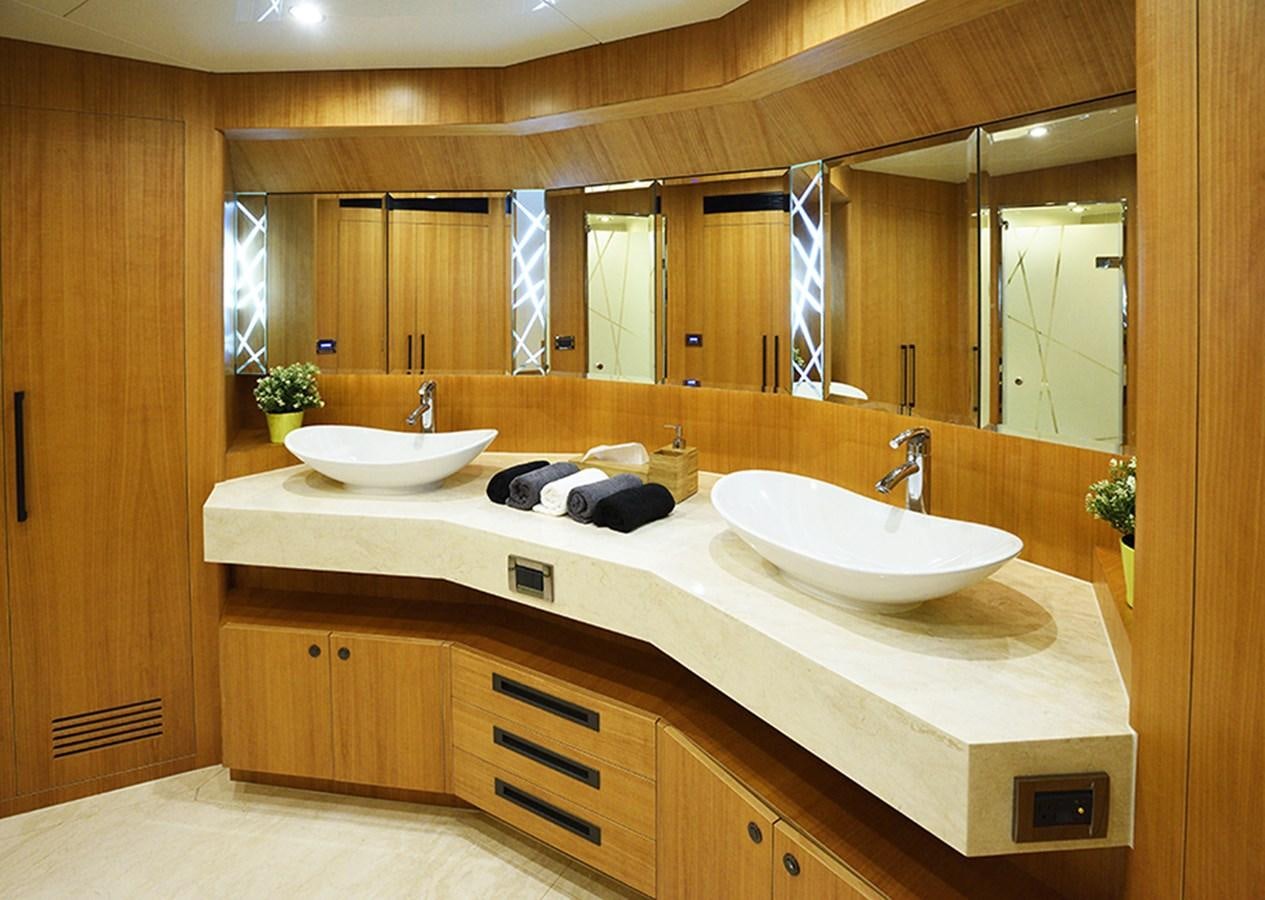 a bathroom with a large mirror aboard DUMB ASS Yacht for Sale