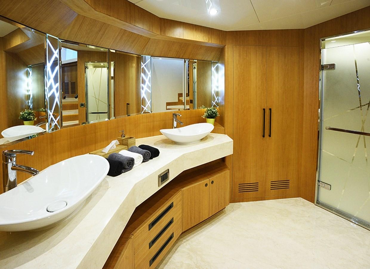 a bathroom with a large mirror aboard DUMB ASS Yacht for Sale