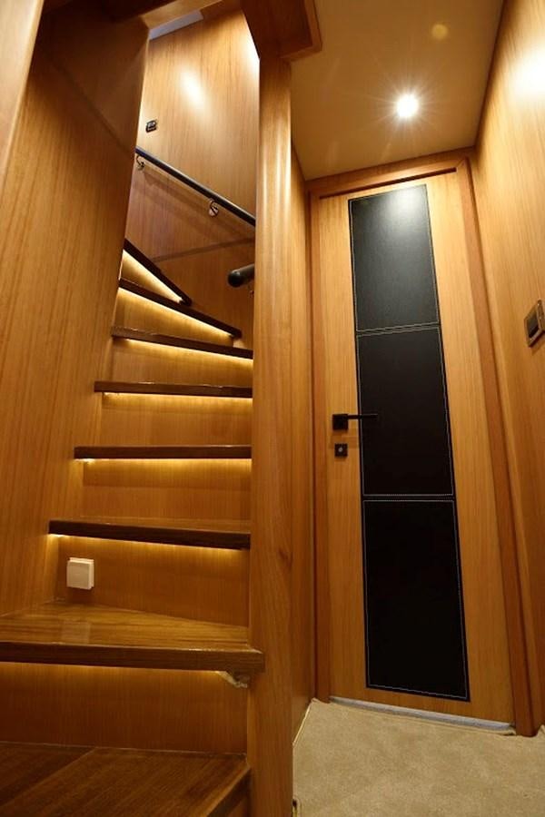 a wooden door with a black door aboard DUMB ASS Yacht for Sale