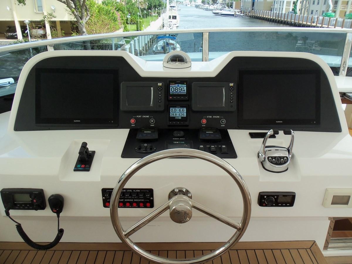 a console with a screen and buttons aboard DUMB ASS Yacht for Sale