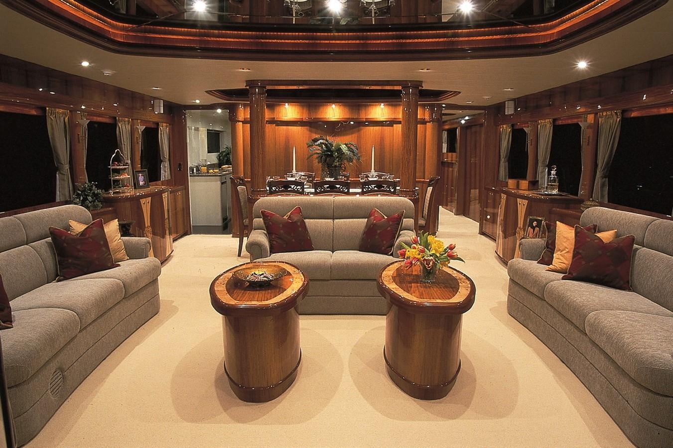 a living room with a couch and a coffee table aboard JOHNSON 93 SKYLOUNGE Yacht for Sale