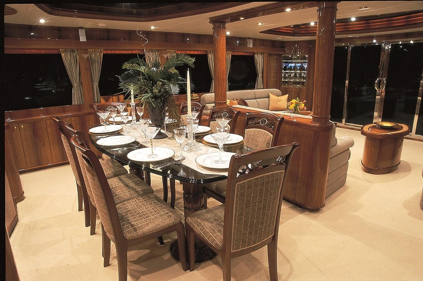 a dining room with a table and chairs aboard JOHNSON 93 SKYLOUNGE Yacht for Sale